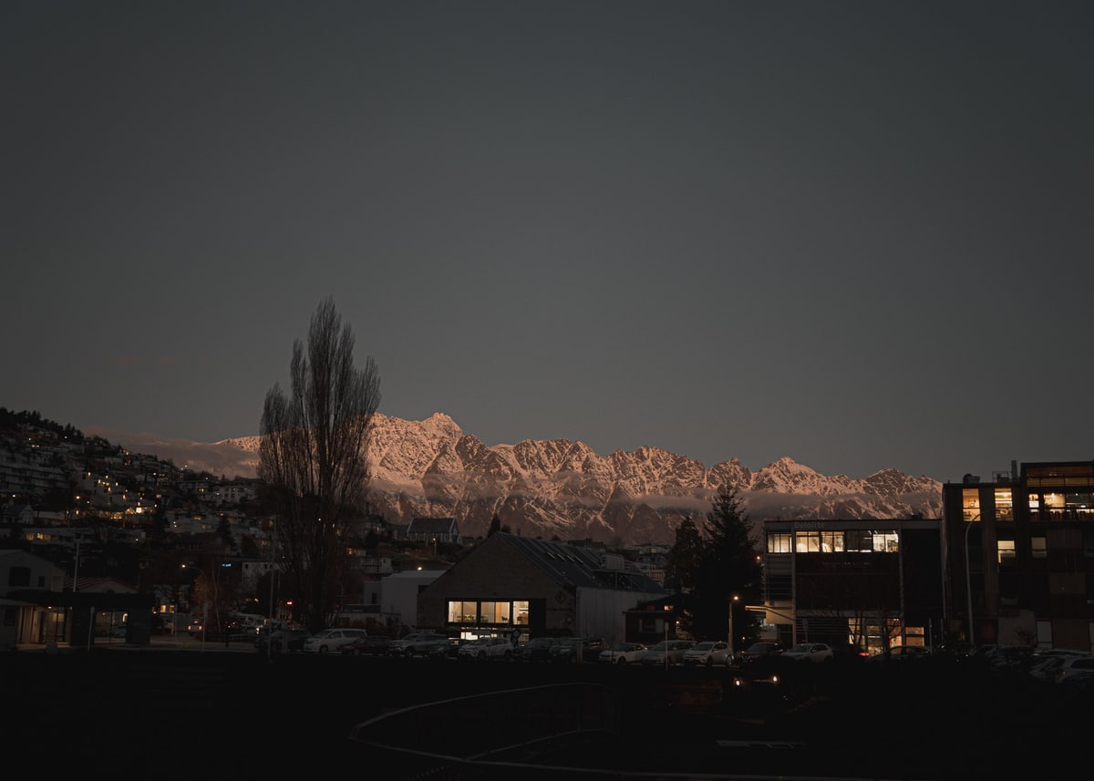 The Remarkables lit pink at dusk above Queenstown