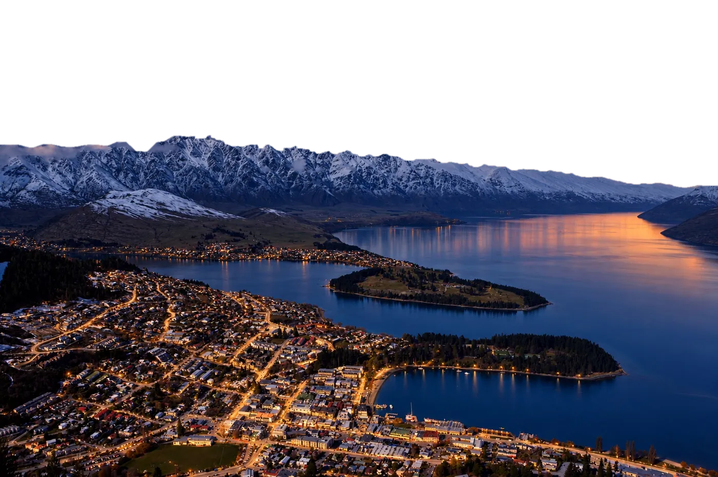 Queenstown at dusk: the lit town, Lake Wakatipu and the Remarkables